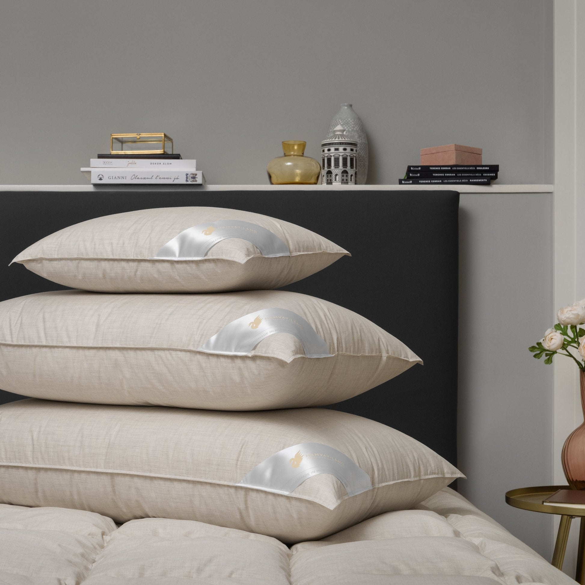 3 goose down pillows on bed, various sizes